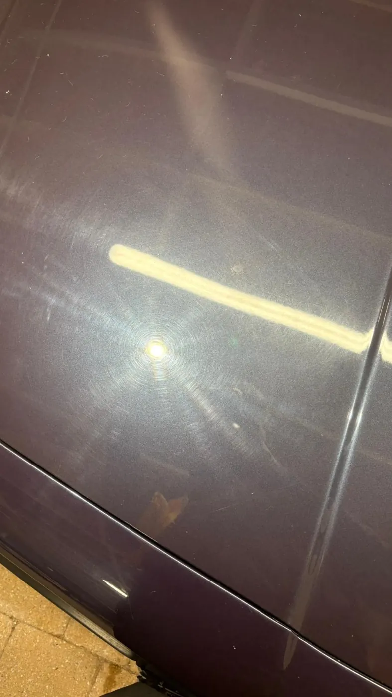 Purple paintwork with swirl marks before correction