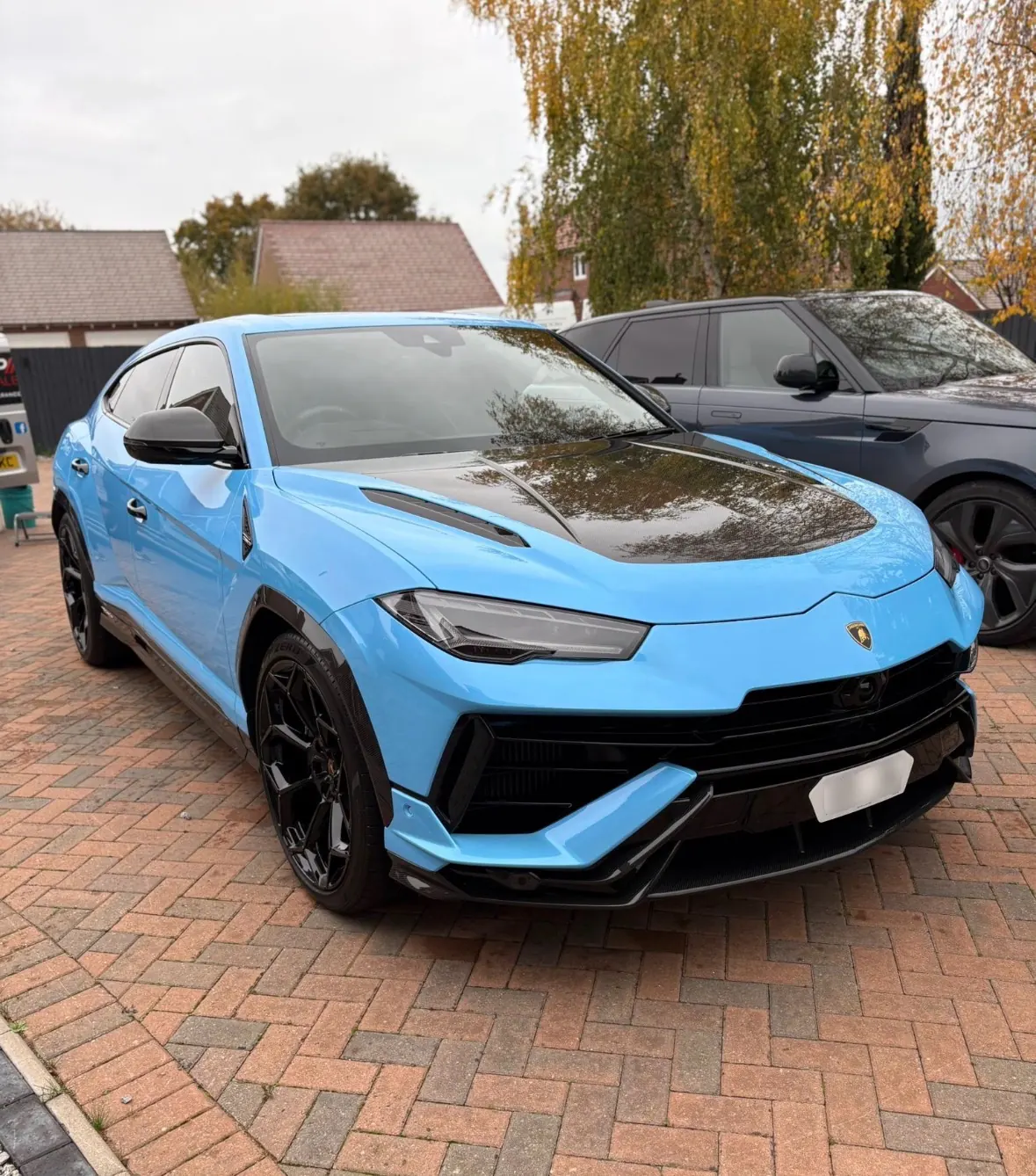 Blue Lamborghini Urus on a driveway